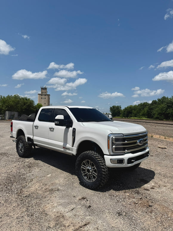 lifted f250 with bubba stance, pmf powdercoated lift and tinted windshield